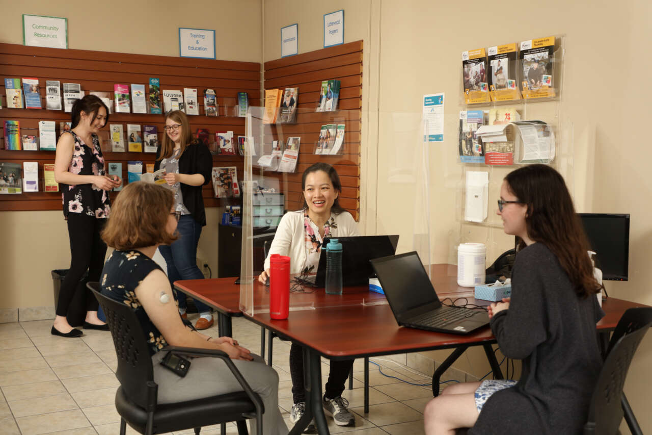 Group of youth talking at a table
